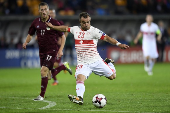 Latvia&#039;s midfielder Edgars Vardanjans, left, fights for the ball with Swiss midfielder Xherdan Shaqiri, right, during the 2018 Fifa World Cup group B qualifying soccer match Latvia against Switze ...