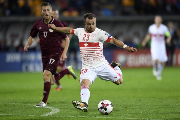 Latvia&#039;s midfielder Edgars Vardanjans, left, fights for the ball with Swiss midfielder Xherdan Shaqiri, right, during the 2018 Fifa World Cup group B qualifying soccer match Latvia against Switze ...