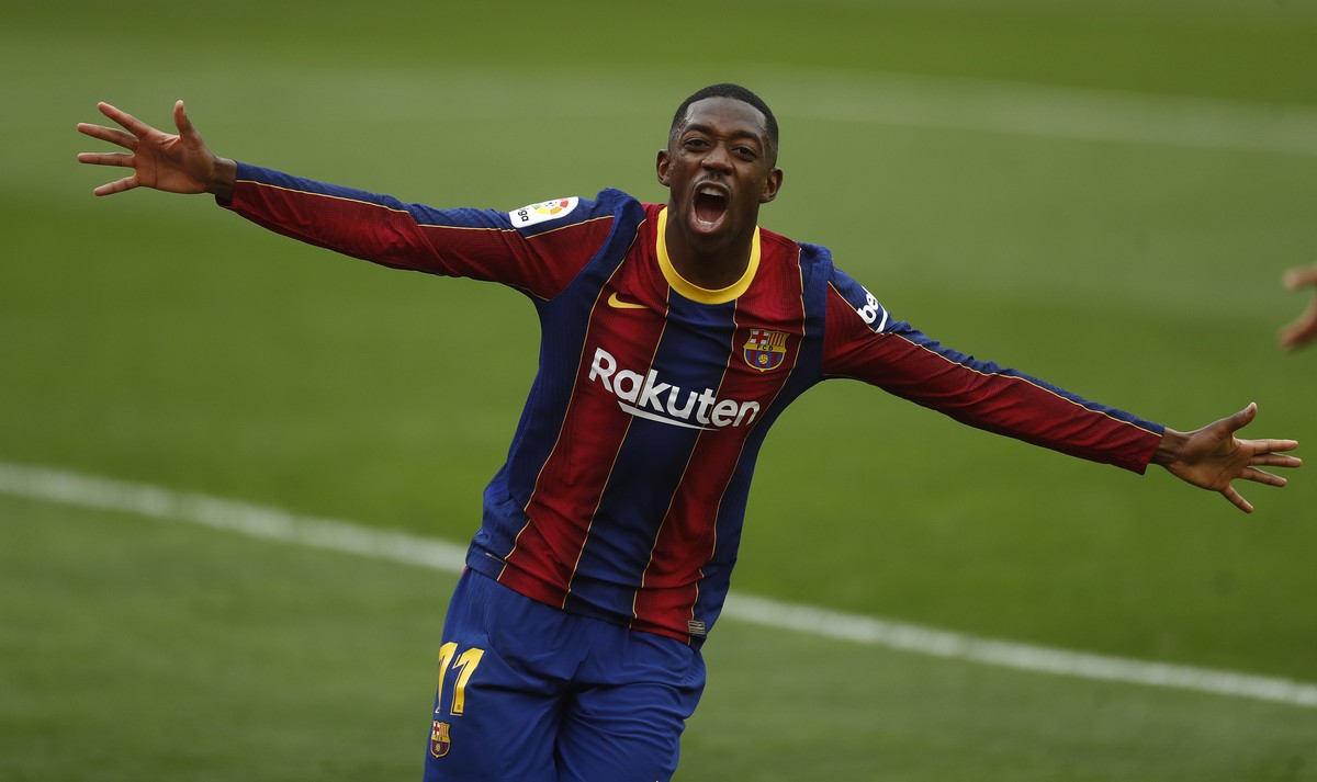 Barcelona's Ousmane Dembele celebrates after scoring during a Spanish La Liga soccer match between Sevilla and Barcelona at the Ramon Sanchez-Pizjuan stadium in Seville, Spain, Saturday Feb. 27,  ...