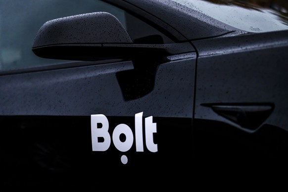 A vehicle with the Bolt ride-hailing service logo arrives for a strike of Uber drivers at Albisguetli, on Monday, October 20, 2025, in Zurich, Switzerland. Drivers of the US ride-hailing service Uber  ...