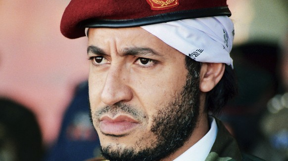 FILE - In this undated file photo made available on Sept. 25, 2011, al-Saadi Gadhafi, son of the late Libyan leader Moammar Gadhafi, watches a military exercise by the elite military unit commanded by ...