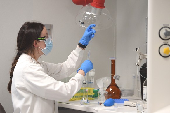 epa08612067 A general view of an analytical chemist at AstraZeneca?s headquarters in Sydney, Australia, 19 August 2020. Australian Prime Minister Scott Morrison announced Australians will be among the ...