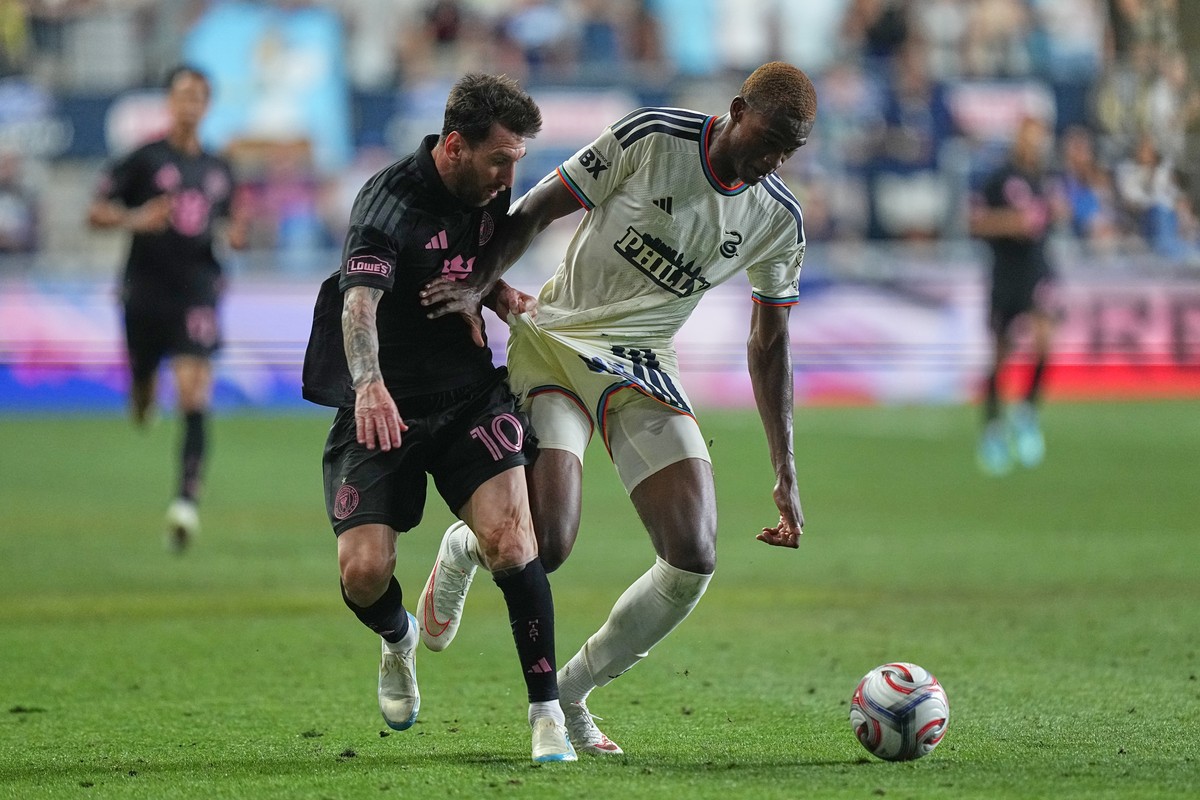 Inter Miami's Leo Messi (10) and Philadelphia Union's Neil Pierre vie for the ball during the second half of an MLS soccer match, Wednesday, Aug. 19, 2026, in Chester, Pa. (AP Photo/Matt Rou ...