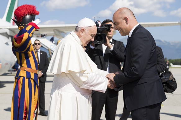 Pope Francis is welcomed by Swiss president Alain Berset, after his arrival in Geneva, Switzerland, Thursday, June 21, 2018. Pope Francis visit the World Council of Churches on 21 June as centrepiece  ...