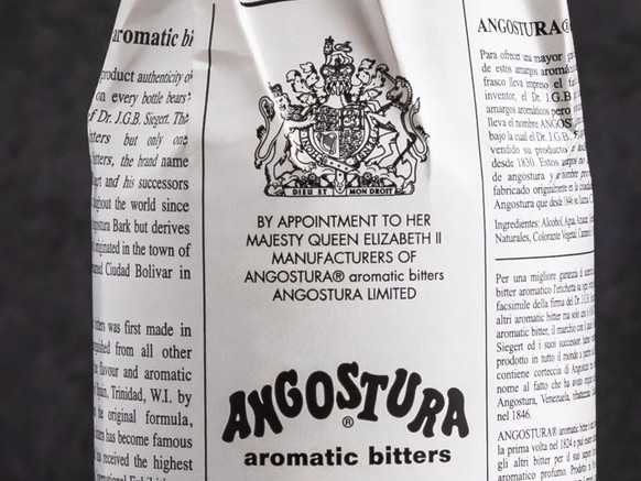 Minsk, Belarus - 14-04-2023: a bottle of Angostura Aromatic Bitters and Angostura Orange Bitters on dark background