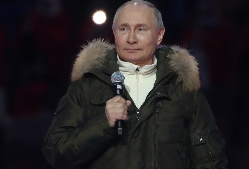 epa09082333 Russian President Vladimir Putin speaks during the concert marking the seventh anniversary of the reunification of the Crimea with Russia, in Moscow, Russia, 18 March 2021. EPA/VYACHESLAV  ...