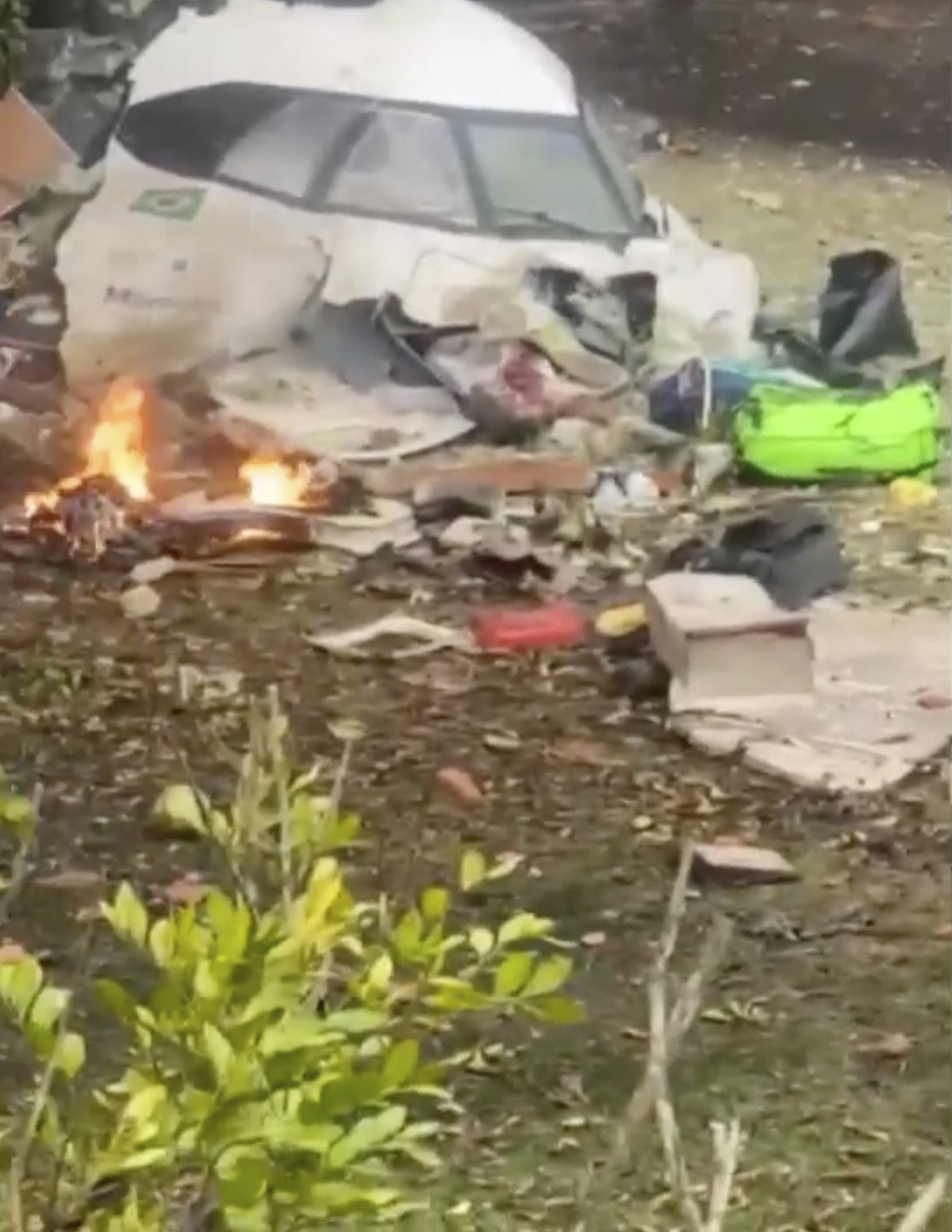 This frame grab from UGC video provided by Felipe Magalhaes Filho shows wreckage from a plane that crashed by a home in Vinhedo, Sao Paulo state, Brazil, Friday, Aug. 9, 2024. (Felipe Magalhaes Filho  ...