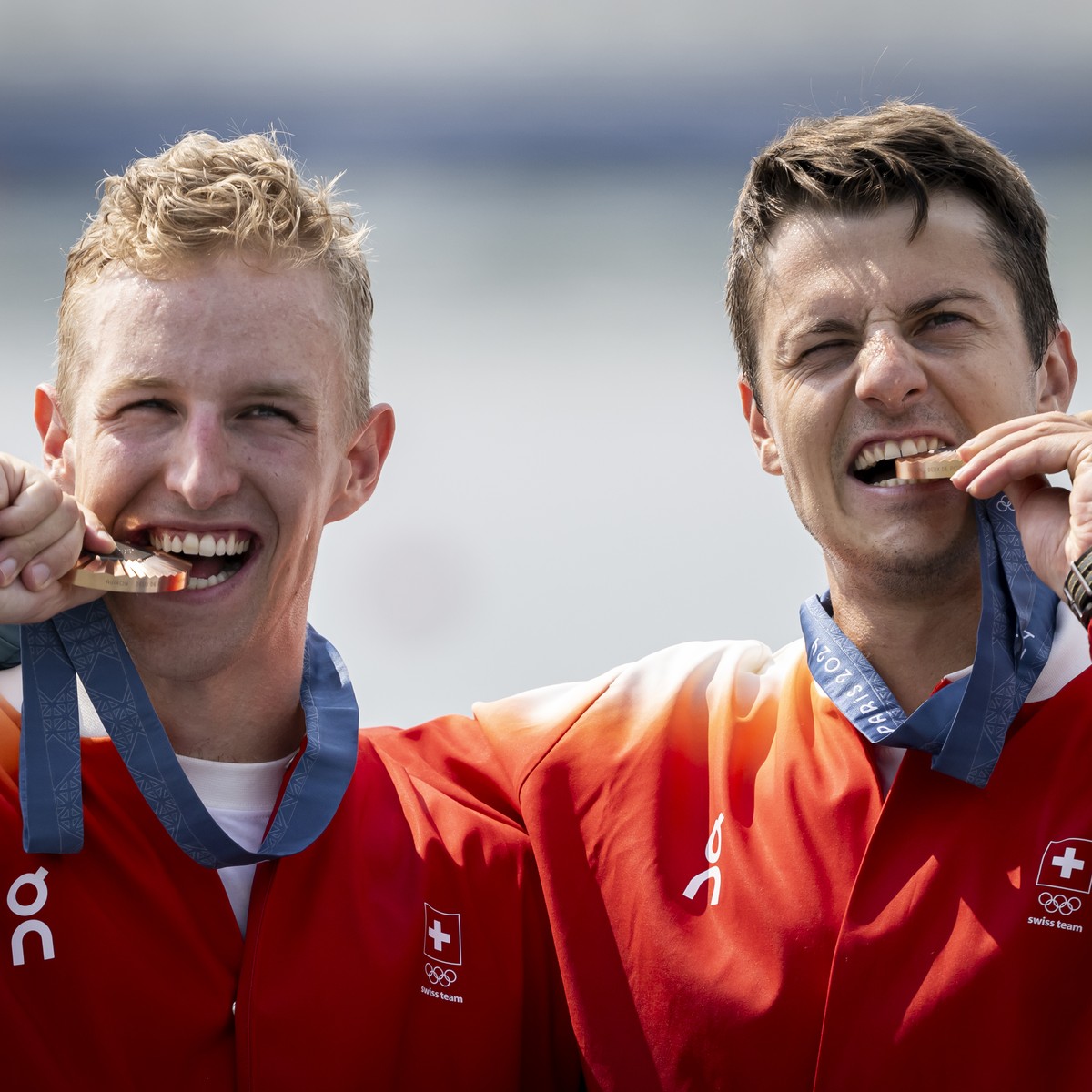 Bronze medallists Andrin Gulich and Roman Roeoesli, celebrate their victory during the medal ceremony, after the men's rowing Pair Final A at the 2024 Paris Summer Olympics in Vaires-Sur-Marne, F ...