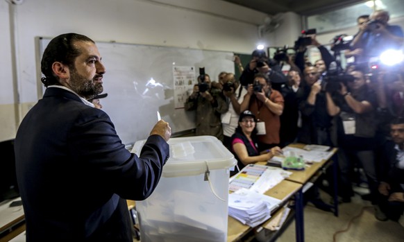 epa06715540 Lebanese Prime minister Saad Hariri casts his ballot at a ballot station in Baabda, south east Beirut, Lebanon, 06 May 2018. There are 976 candidates, including 111 women, competing for 12 ...