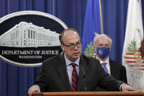 Acting Assistant U.S. Attorney General Jeffrey Clark speaks as he stands next to Deputy Attorney General Jeffrey A. Rosen during a news conference to announce the results of the global resolution of c ...