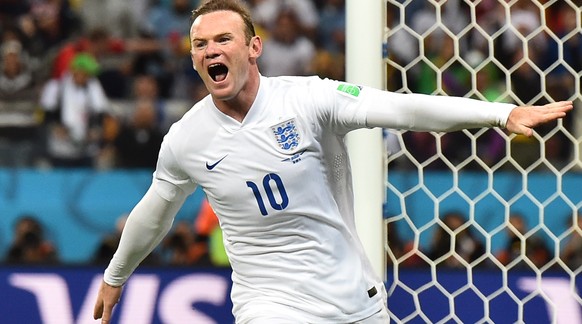 (FILES) In a file picture taken on June 19, 2014 England&#039;s forward Wayne Rooney celebrates after scoring past Uruguay&#039;s goalkeeper Fernando Muslera during the Group D football match between  ...