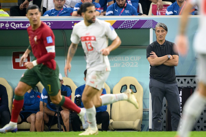 Switzerland&#039;s head coach Murat Yakin, right, looking at Portugal&#039;s forward Cristiano Ronaldo, left, and Switzerland&#039;s defender Ricardo Rodriguez, center, during the FIFA World Cup Qatar ...