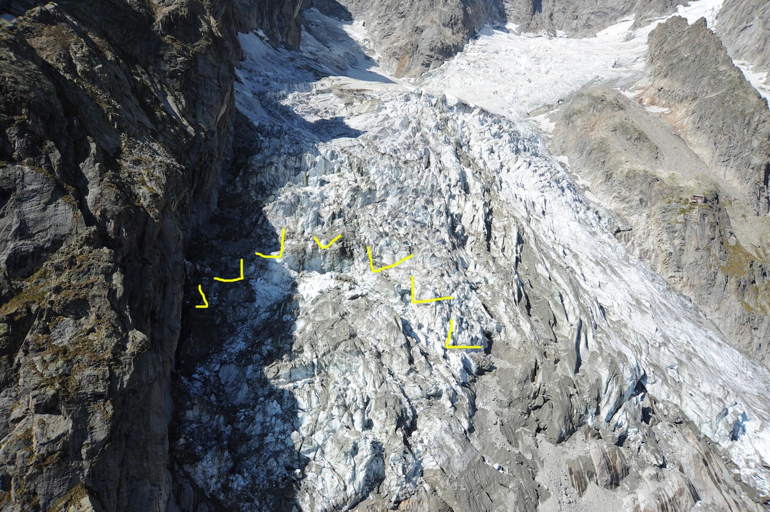 epa07868046 A handout photo made available by the Municipality of Courmayeur shows an aerial view of the Planpincieux glacier (section of the glacier at risk of collapse highlighted by authorities in  ...