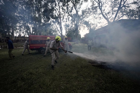 Jammu and Kashmir firefighter conduct a special training for civilians and police to respond appropriately in case of an armed attack, in Akhnoor, on the outskirts of Jammu, India, Saturday, May 31, 2 ...