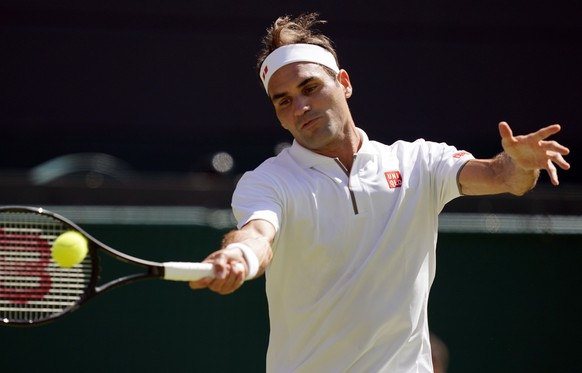 epa07694785 Roger Federer of Switzerland returns to Jay Clarke of Britain in their second round match during the Wimbledon Championships at the All England Lawn Tennis Club, in London, Britain, 04 Jul ...