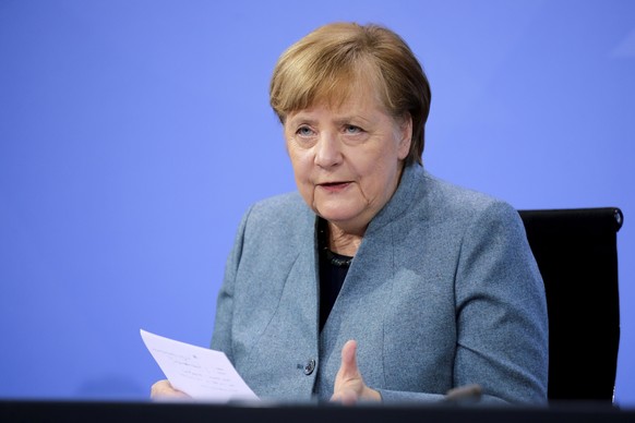 German Chancellor Angela Merkel holds a news conference after meeting with vaccine producers and Germany&#039;s state prime ministers via video conference, in Berlin, Germany, Monday Feb. 1, 2021. (Ha ...