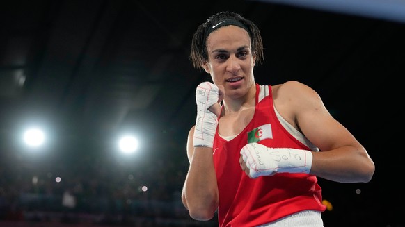 Algeria&#039;s Imane Khelif poses after defeating China&#039;s Yang Liu to win gold in their women&#039;s 66 kg final boxing match at the 2024 Summer Olympics, Friday, Aug. 9, 2024, in Paris, France.  ...