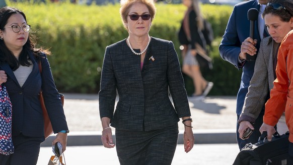 FILE - In this Oct. 11, 2019, file photo, former U.S. ambassador to Ukraine Marie Yovanovitch, center, arrives on Capitol Hill, Friday, Oct. 11, 2019, in Washington, to testify before congressional la ...