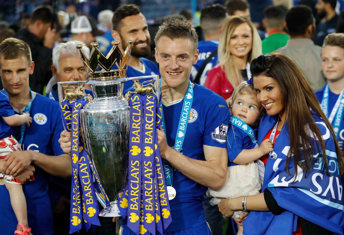 FILE - Leicester's Jamie Vardy lifts the trophy as Leicester City celebrate becoming the English Premier League soccer champions at King Power stadium in Leicester, England, Saturday, May 7, 2016 ...