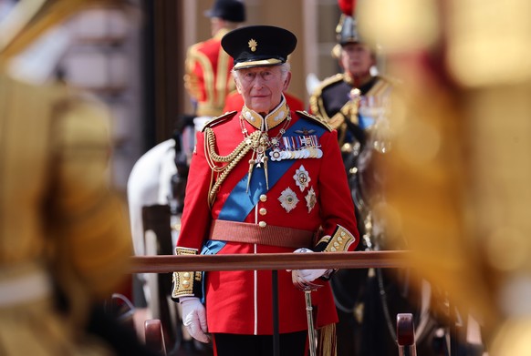 epa13034518 Britains King Charles III inspects his troops outside Buckingham Palace during the Trooping the Colour, The Kings Birthday Parade in London, Britain, 13 June 2026. Trooping the Colour is ...