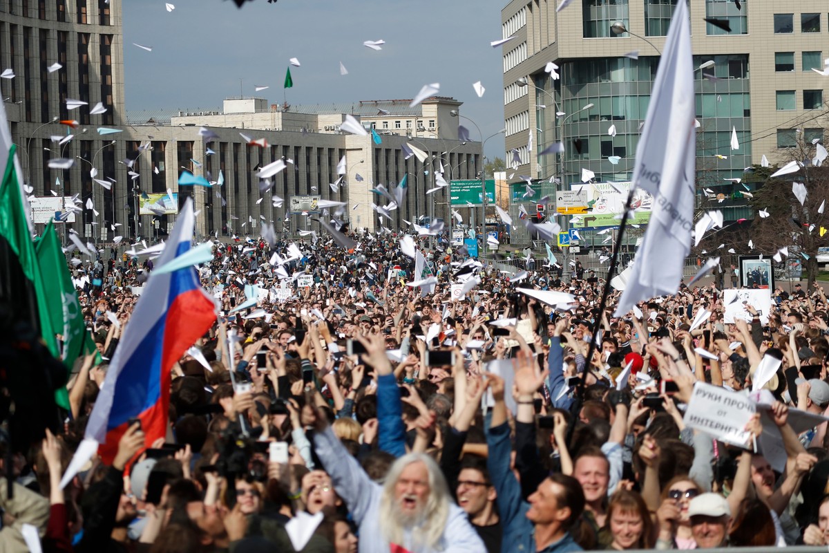 Protesters launch paper airplanes as they gather at a central street to rally against authorities' move to block parts of the internet in Russia in Moscow, Russia, Monday, April 30, 2018. Some 10 ...