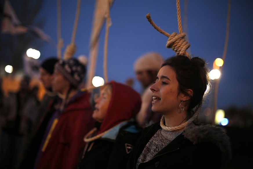 Activists protest outside of the COP25 climate talks congress in Madrid, Spain, Saturday, Dec. 14, 2019. The United Nations Secretary-General has warned that failure to tackle global warming could res ...