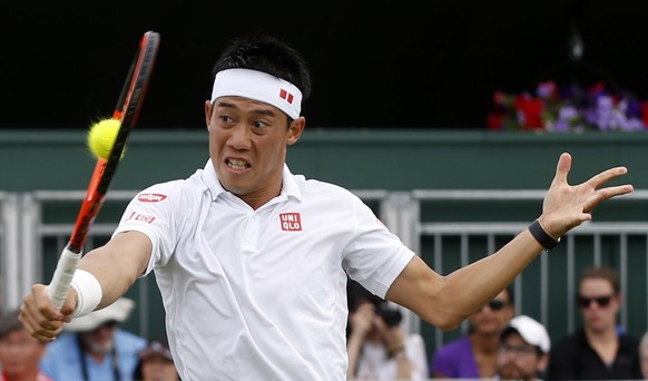 Japan&#039;s Kei Nishikori returns to Italy&#039;s Marco Cecchinato during their Men&#039;s Singles Match on the opening day at the Wimbledon Tennis Championships in London Monday, July 3, 2017. (AP P ...