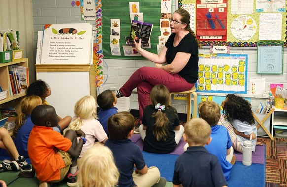 Kindergarten teacher Lynola Vis reads a book in class at Phoenix Christian School PreK-8 in Phoenix, Tuesday, Oct. 25, 2022. School choice allows taxpayer money to pay for private school tuition inste ...