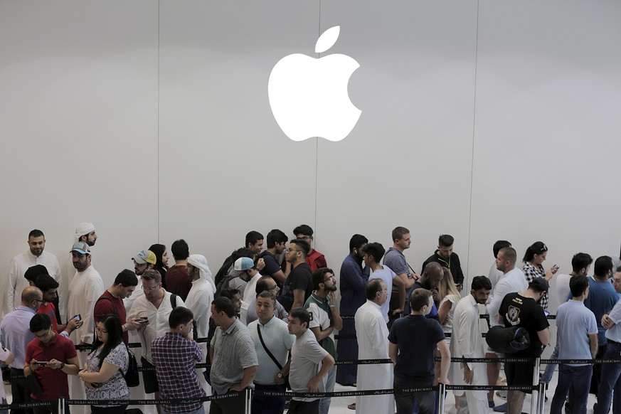 epa07137110 (FILE) - Customers queue outside an Apple store during the launch of the new iPhone X at Dubai Mall in Dubai, UAE, 03 November 2017 (reissued 02 November 2018). Apple on 02 November 2018 r ...