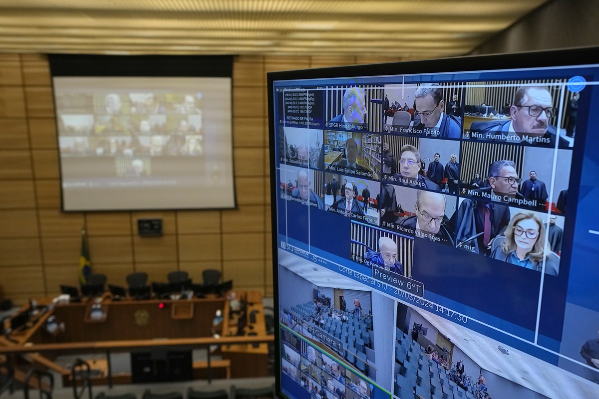 A monitor set up in a conference room at the Supreme Court shows live video of judges holding a session in another area of the court in Brasilia, Brazil, Wednesday, March 20, 2024. Judges started on W ...