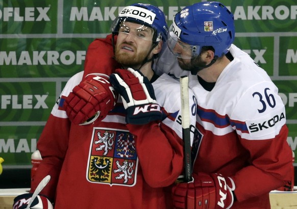 Petr Caslava of the Czech Republic (R) talks with team mate Jakub Nakladal during their Ice Hockey World Championship game against Switzerland at the O2 arena in Prague, Czech Republic May 12, 2015.  REUTERS/David W Cerny 
