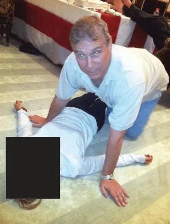 Story from Jam Press Epstein Files Pictured: Andrew Mountbatten-Windsor crouched on all fours over an unidentified woman lying on the floor, in images released as part of the Jeffrey Epstein files. PH ...