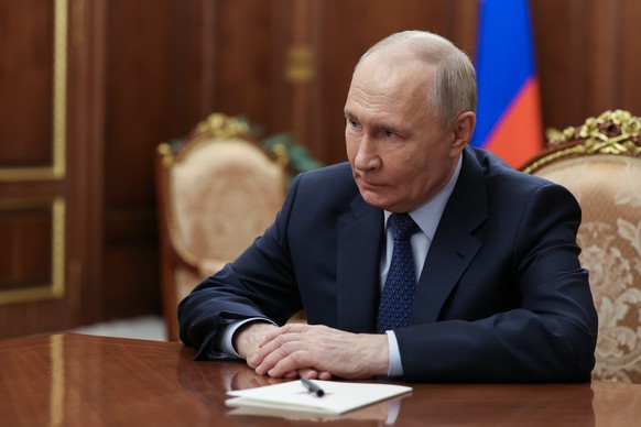 epa13083419 Russian President Vladimir Putin meets with VTB Bank President and Chairman of the Management Board Andrey Kostin (not pictured) at the Kremlin in Moscow, Russia, 03 July 2026. EPA/GAVRIIL ...