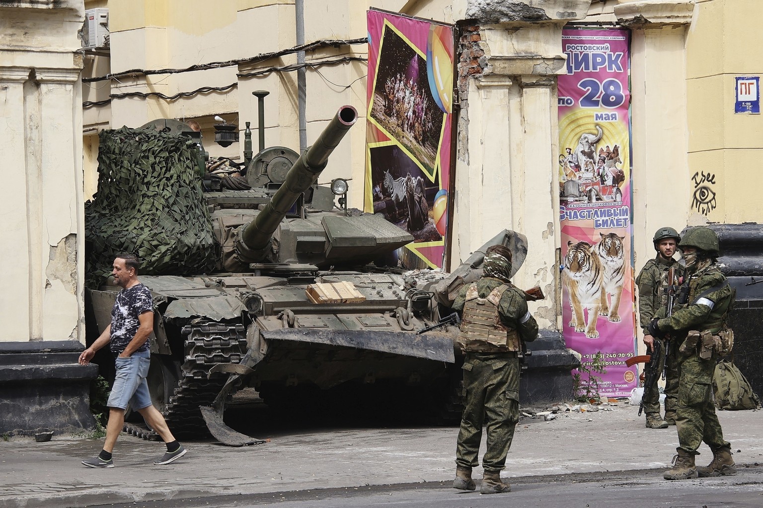 FILE - Members of the Wagner Group military company guard an area standing in front of a tank in a street in Rostov-on-Don, Russia, Saturday, June 24, 2023. Russia?s rebellious mercenary chief Yevgeny ...