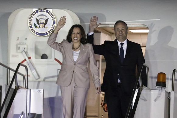 U.S. Vice President Kamala Harris, left, and her husband Douglas Emhoff arrive at Julius Nyerere International Airport in Dar es Salaam on Wednesday, March 29, 2023.  (Ericky Boniphace/Pool Photo via AP) ...