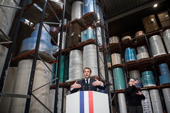 epa08334437 French President Emmanuel Macron gives a speech at the end of a visit to the Kolmi-Hopen protective face masks factory in Saint-Barthelemy-d'Anjou near Angers, central France, 31 March 2020 amid a new coronavirus (COVID-19) pandemic. France has ordered 1 billion face masks and has deployed an air-bridge flight with China to deliver them amid the ongoing coronavirus COVID-19 pandemic.  EPA/LOIC VENANCE / POOL MAXPPP OUT