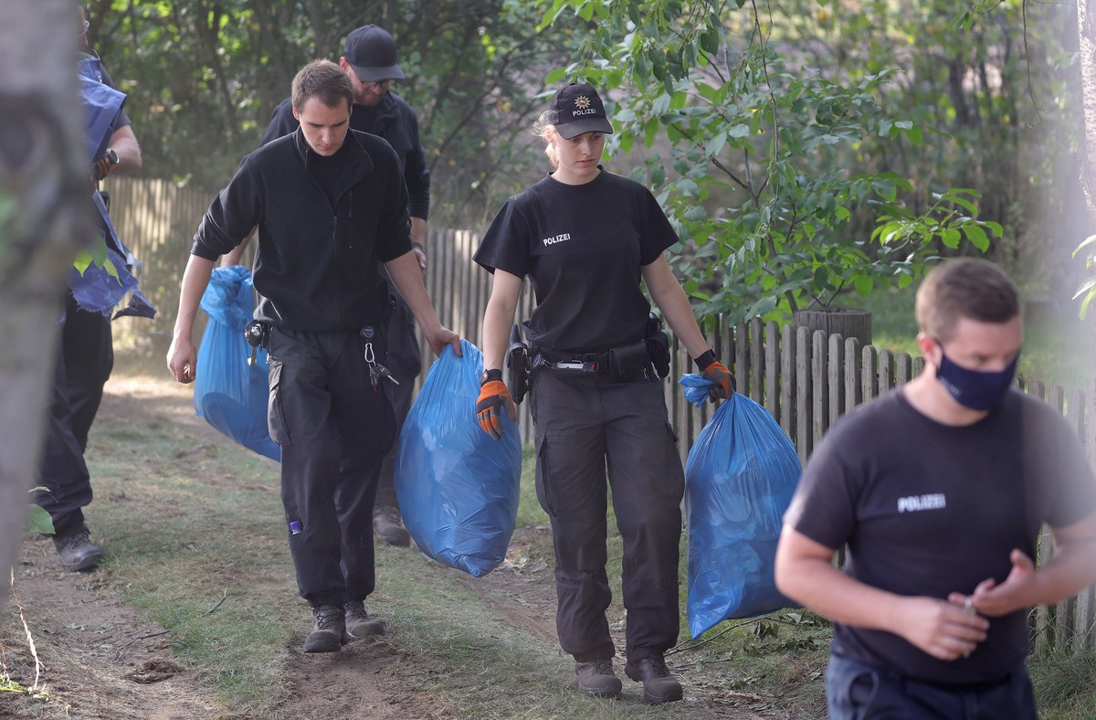 epa08573009 Police leave the operation site after search a garden plot in Hannover, northern Germany, 29 July 2020. Police is working on the site in relation to the investigation of the Madeleine  ...