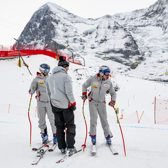 Marco Kohler of Switzerland and Marco Odermatt of Switzerland in action during the inspection before the men's Downhill training race at the Alpine Skiing FIS Ski World Cup, in Wengen, Switzerlan ...