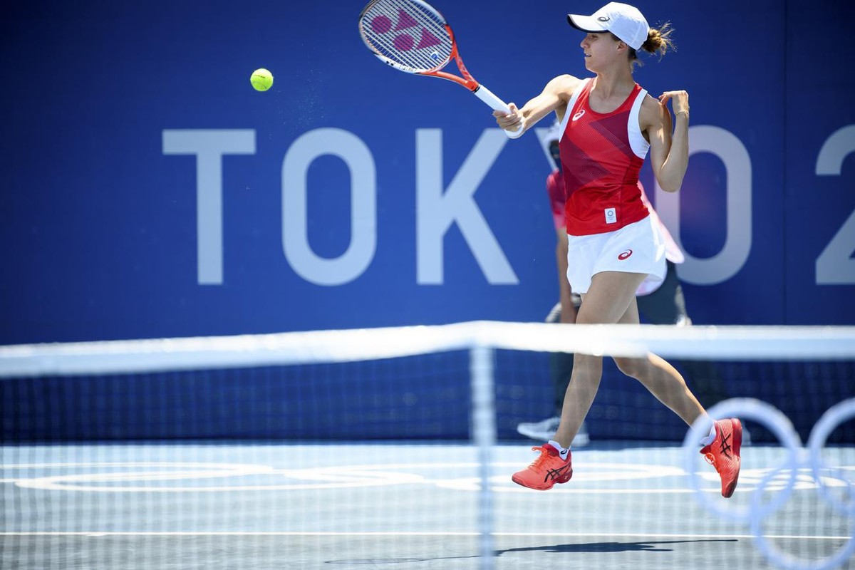 Viktorija Golubic of Switzerland returns a ball to Maria Camila Osorio Serrano of Colombia during the women's single tennis first round match at the 2020 Tokyo Summer Olympics at the Ariake Tenni ...