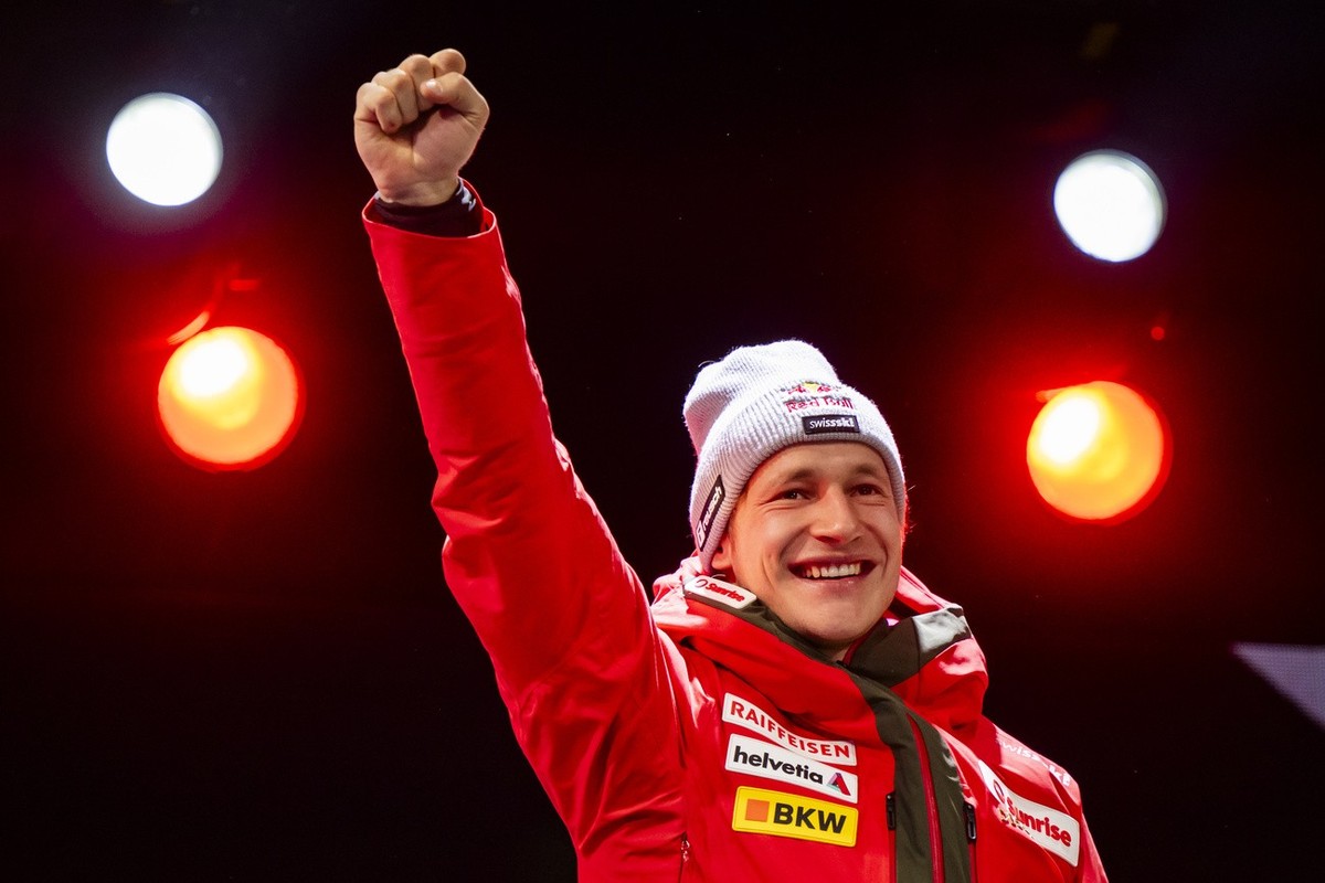 The winner Marco Odermatt of Switzerland celebrates during victory ceremony of the men's Downhill race at the Alpine Skiing FIS Ski World Cup, in Wengen, Switzerland, Saturday, January 18, 2025.  ...