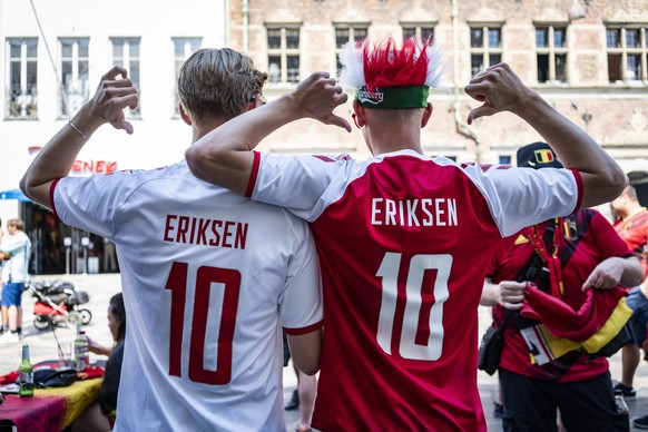 epa09279756 Danish fans wearing Christian Eriksen jersey cheer in Copenhagen, Denmark, 17 June 2021, hours before the start of the Group B match of EURO2020 between Denmark and Belgium. EPA/Emil Helms ...