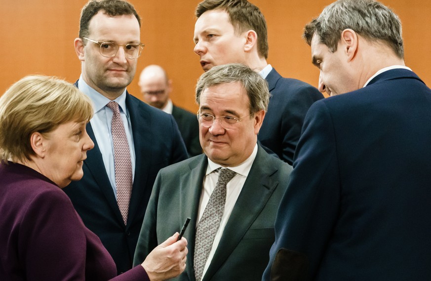 epa08289773 German Chancellor Angela Merkel (L), North Rhine-Westphalia State Premier Armin Laschet (3-L), State Premier of Bavaria Markus Soeder (R) talk next German Health Minister Jens Spahn (2-L)  ...