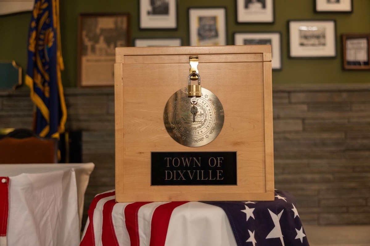 DIXVILLE NOTCH, NEW HAMPSHIRE - JANUARY 22: The Dixville ballot box is displayed in front of voting booths in the Tillotson House during preparations for midnight voting on January 22, 2024 in Dixvill ...