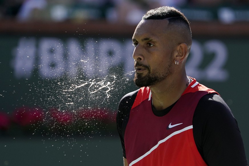 Nick Kyrgios, of Australia, spits while playing Rafael Nadal, of Spain, during a quarterfinal match in the BNP Paribas Open tennis tournament Thursday, March 17, 2022, in Indian Wells, Calif. (AP Phot ...