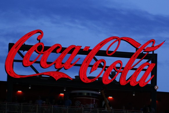 In this July 20, 2019, photo a Coca-Cola billboard is shown over left field at SunTrust Park during a baseball game between the Washington Nationals and Atlanta Braves in Atlanta. The Coca-Cola Co. re ...