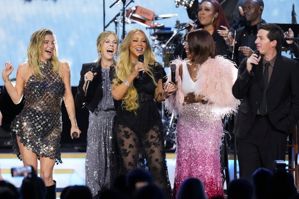Kesha, from left, R/ita Wilson, Mariah Carey, Gayle King, and Charlie Puth perform during MusiCares Person of the Year honoring Mariah Carey on Friday, Jan. 30, 2026, in Los Angeles. (AP Photo/Chris P ...