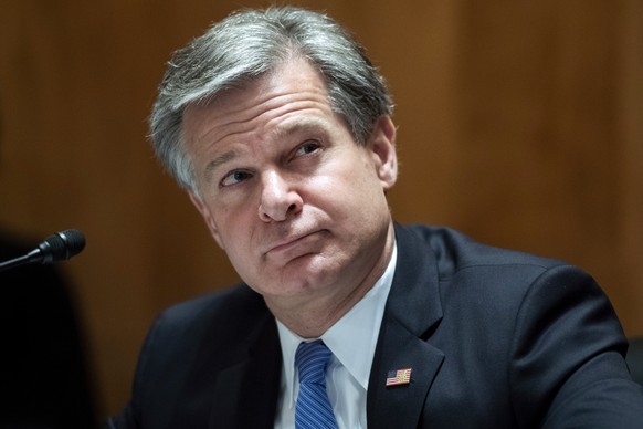 FILE - In this Sept. 24, 2020 file photo, FBI Director Christopher Wray, testifies during a Senate Homeland Security and Governmental Affairs Committee hearing on &quot;Threats to the Homeland&quot; o ...