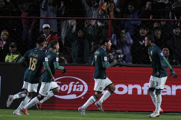 Bolivia&#039;s Miguel Terceros, center, celebrates with teammates after scoring his side&#039;s opening goal from the penalty spot during a World Cup 2026 qualifying soccer match against Brazil at Vil ...