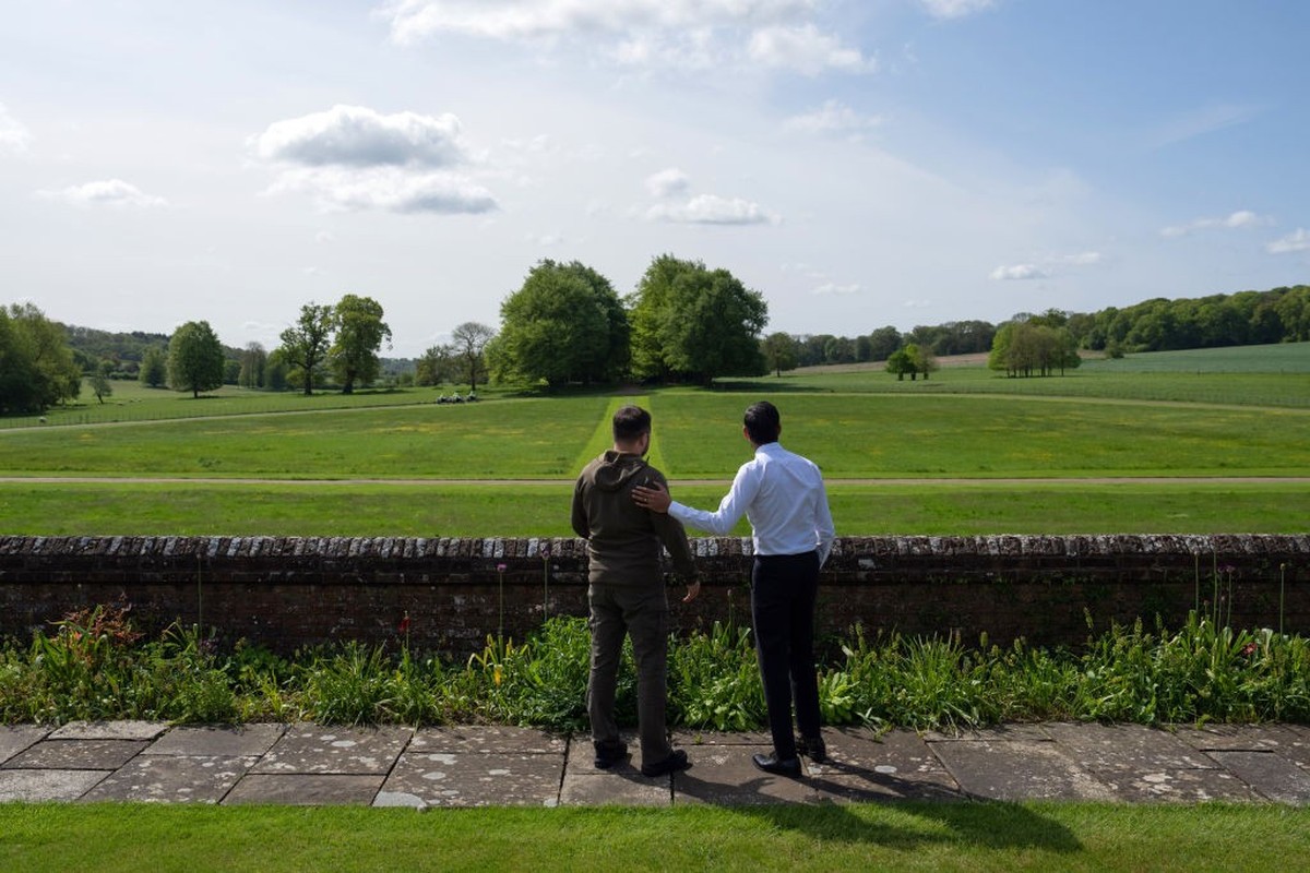 AYLESBURY, ENGLAND - MAY 15: Britain's Prime Minister, Rishi Sunak (R), and Ukraine's President, Volodymyr Zelenskyy, look out towards trees planted by Winston Churchill as they walk in the  ...