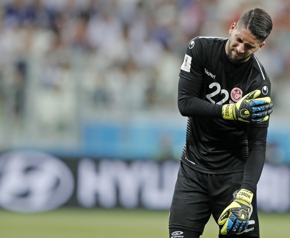 Tunisia goalkeeper Mouez Hassen has to leave the pitch injured during the group G match between Tunisia and England at the 2018 soccer World Cup in the Volgograd Arena in Volgograd, Russia, Monday, Ju ...